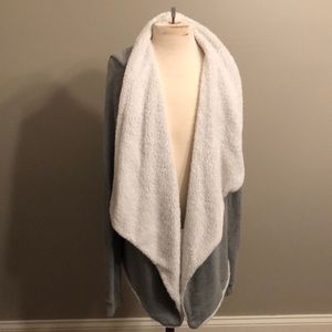 Gray cardigan with white inside.